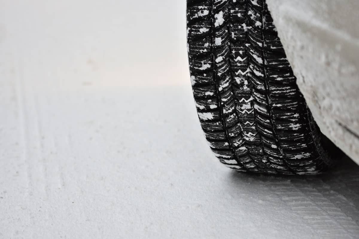New car tire moving on snow