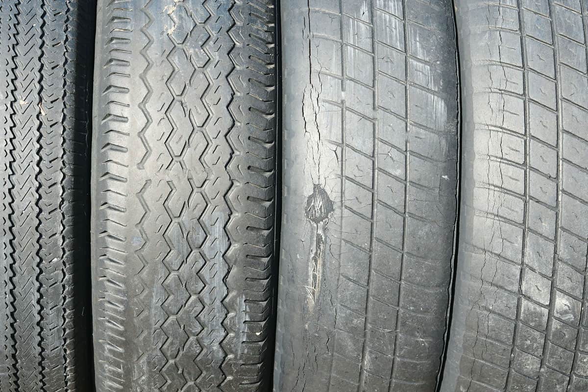 Old summer tires with various damages