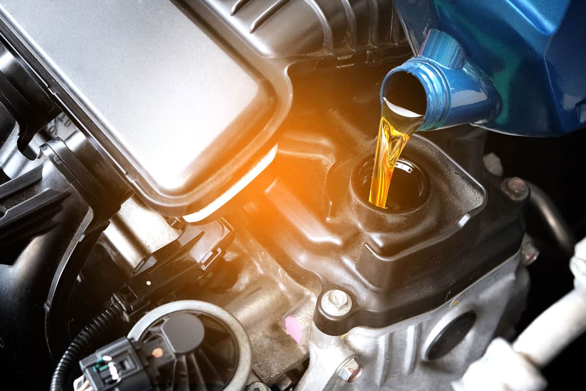 Pouring car engine oil