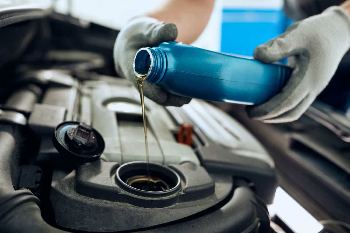 Pouring new car engine oil