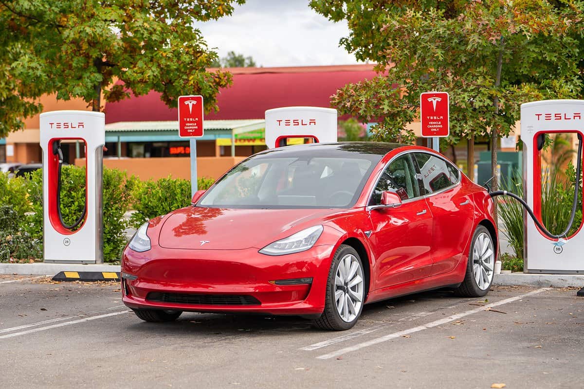 Red Tesla at the charging station