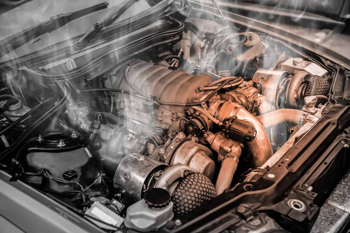 Smoking car engine due to overheating