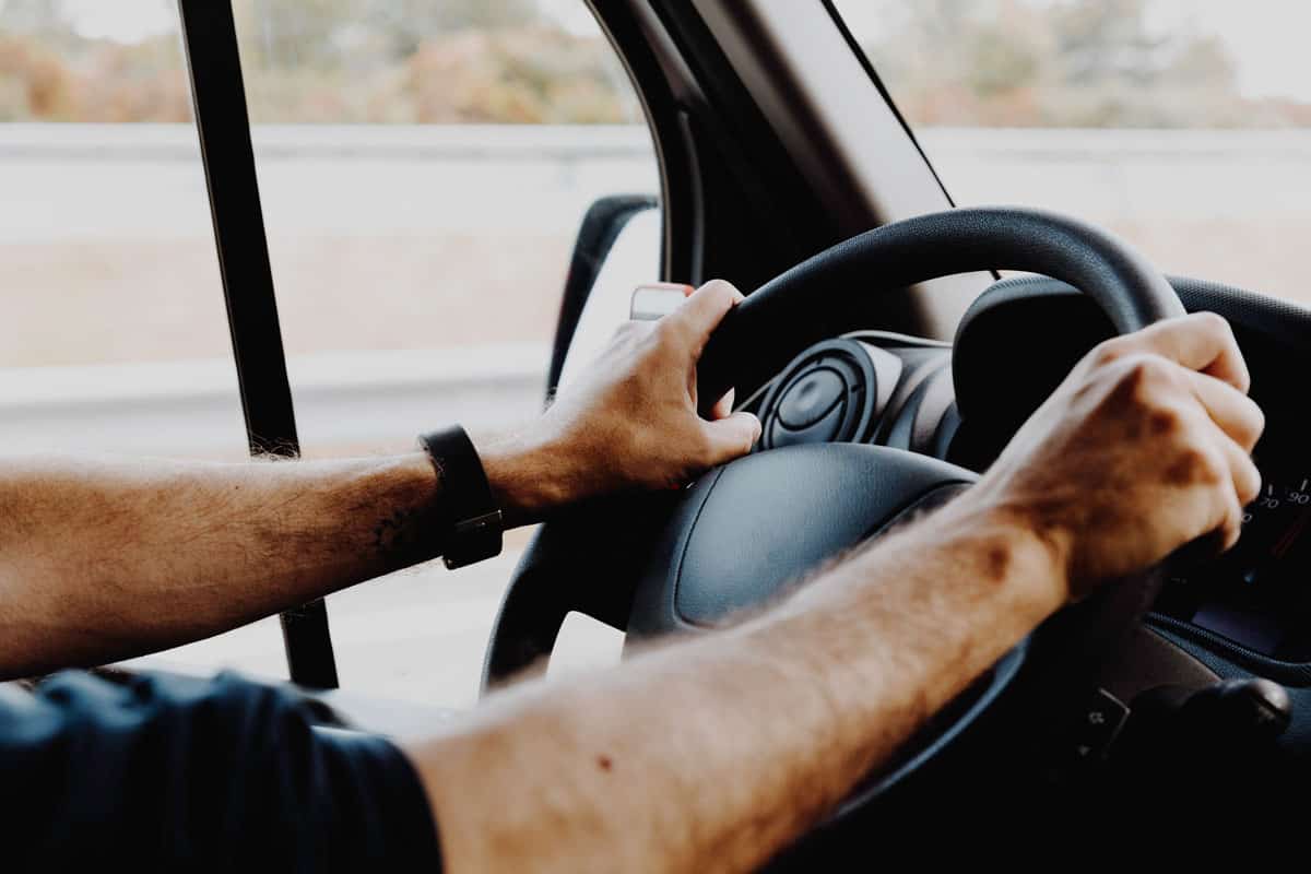 Truck driver holding a steering wheel
