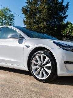 White Tesla Model 3 parked on the street