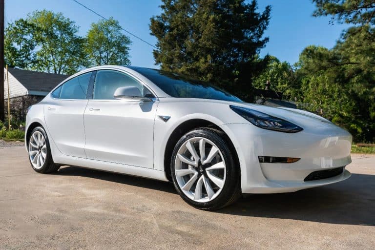White Tesla Model 3 parked on the street