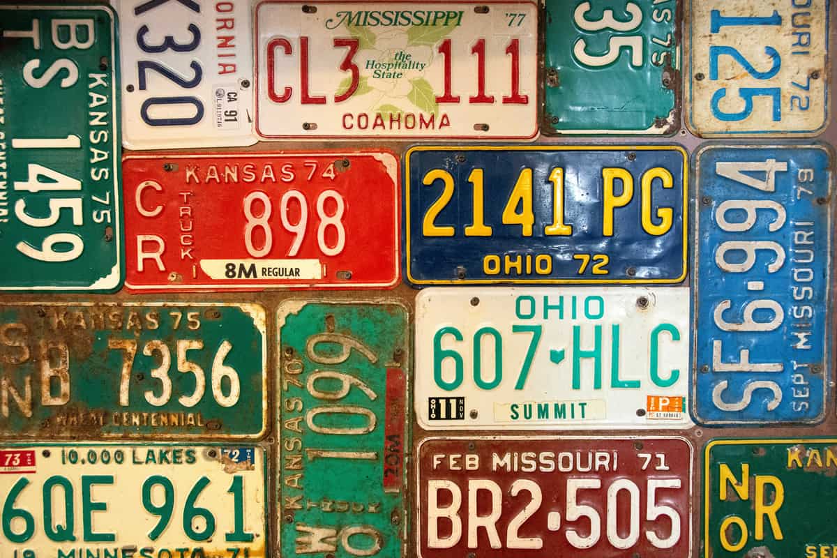 rusty retro automobile license plate collection background