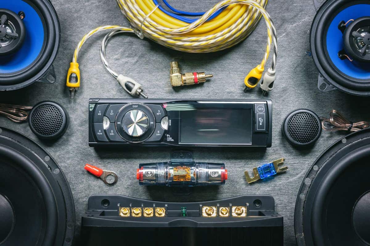 A car audio equipment on dark flat lay background.