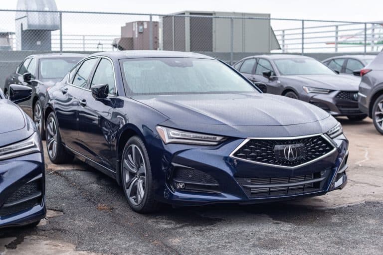 A dark blue colored ACURA ILX at a top floor parking area, Acura ILX Windows Open By Themselves - Why And What To Do?
