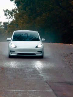 A fast moving Tesla Model 3 on the highway, Tesla Model 3: Electrical System Backup Power Is Unavailable - What To Do?