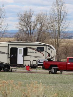 A fifth wheel camper and truck begin their set up at Cherry Creek State Park in Denver., How To Reduce 5th Wheel Hitch Weight