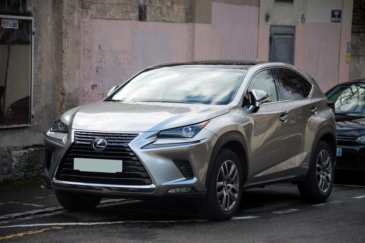 A gray colored Lexus UX at a street parking area