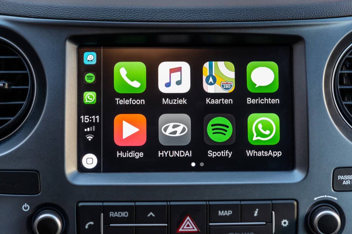 Apple CarPlay main screen in modern car dashboard. CarPlay is an Apple standard that enables a car radio or head unit to be a display and controller for an iPhone.