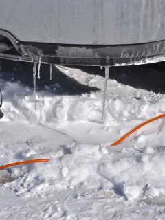An extension cord runs to a head bolt heater on a car, Can You Leave An Engine Block Heater Plugged In Overnight?