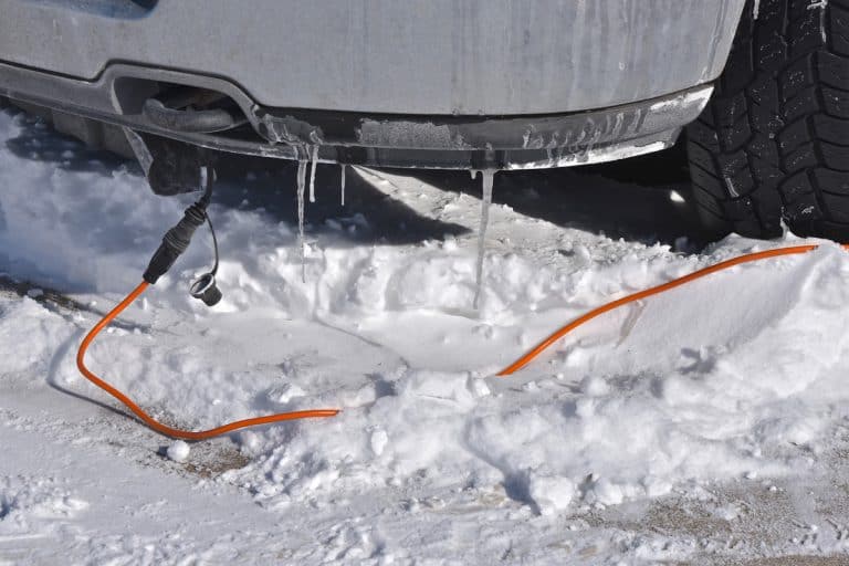 An extension cord runs to a head bolt heater on a car, Can You Leave An Engine Block Heater Plugged In Overnight?