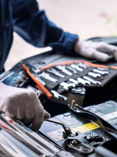 Auto mechanic working in the garage, Service and maintenance and car maintenance, Will Disconnecting A Car's Battery Reset Transmission?