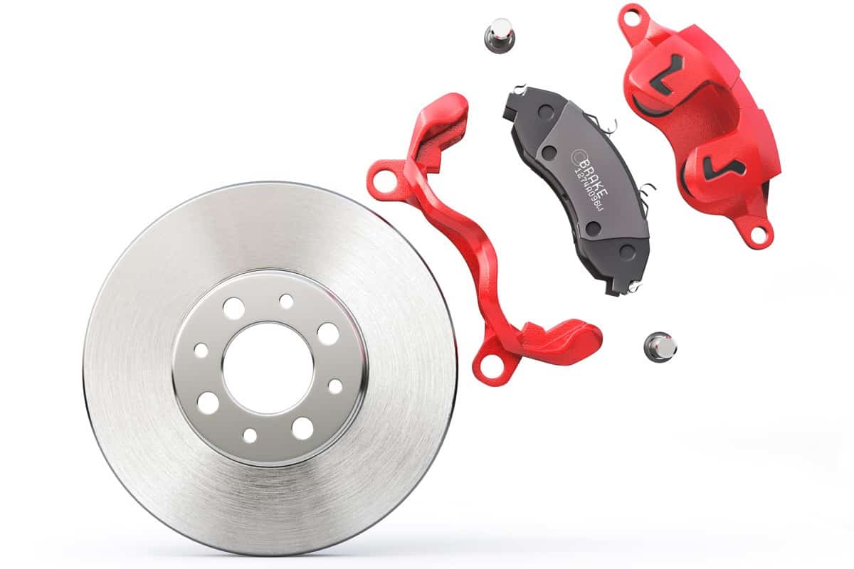 Blown up photo of a car disk brake and brake calipers