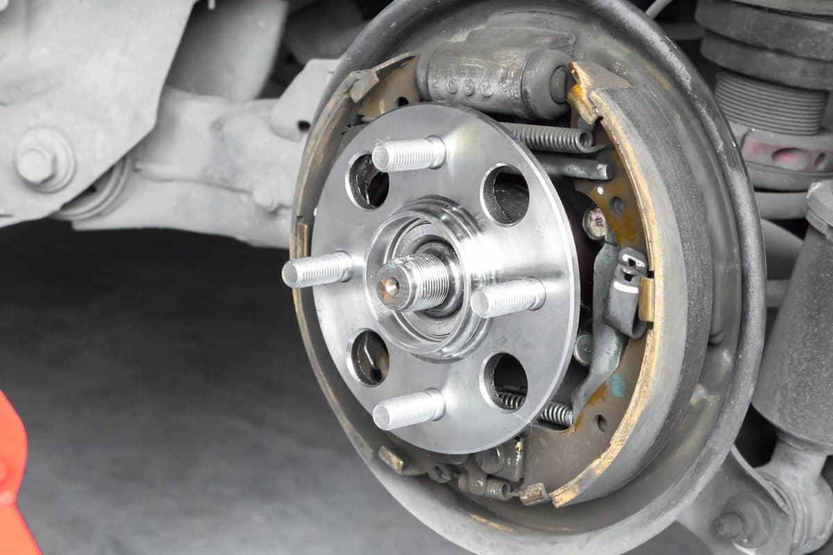 Car Suspension and car bearing parts concept - New rear wheels car bearing for drum brake type bearing on replacement service in garage