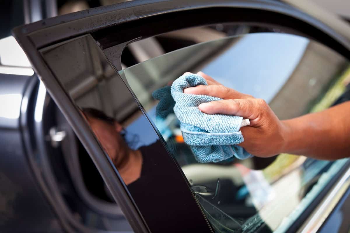 Cleaning the windows of car