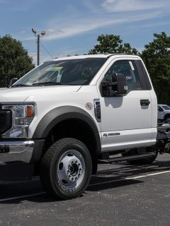 Ford F-450 display at a dealership available in chassis cab, flatbed and dump truck models, Are Truck Flatbeds Universal?