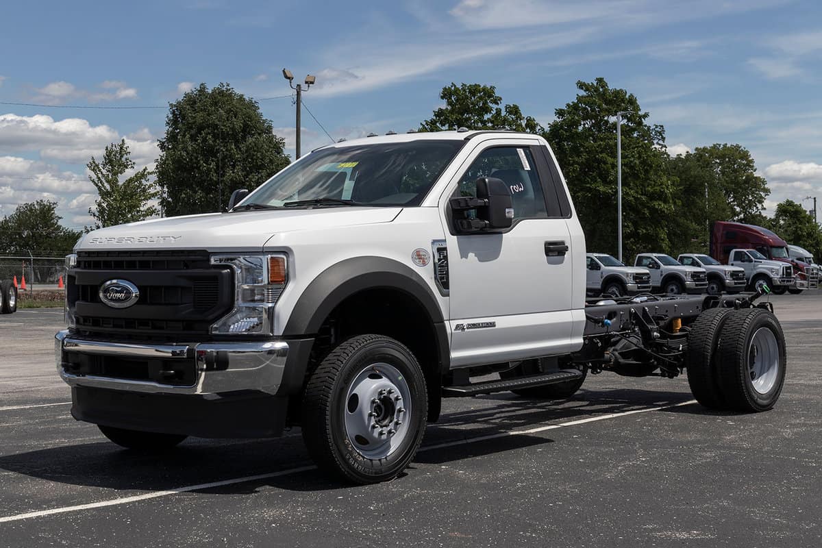 Ford F-450 display at a dealership available in chassis cab, flatbed and dump truck models