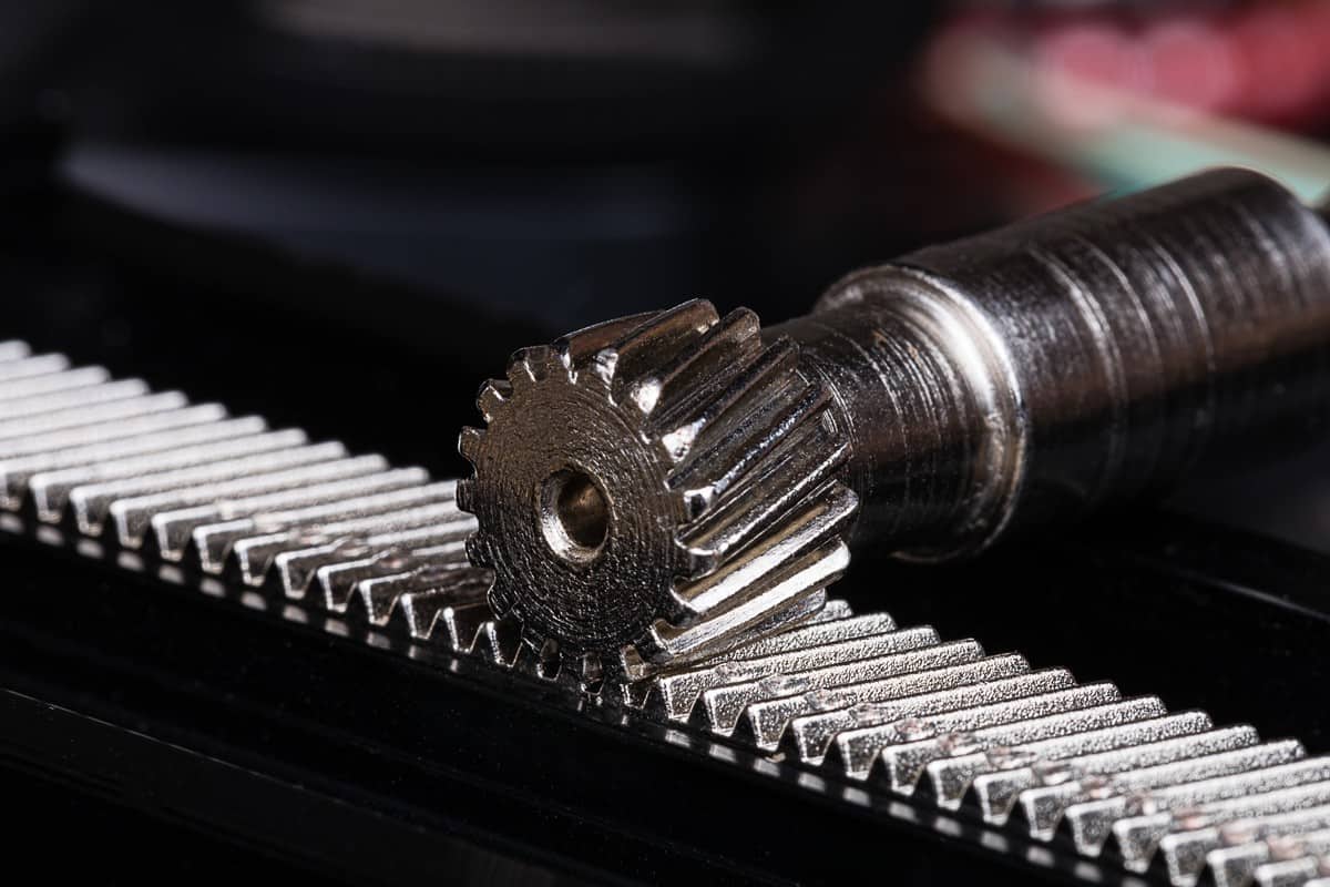Linear Rack gear with a pinion gear. Mechanism for linear precision mechanical motion. Often part of a step motor positioning system or a macro positioning system utilizing step motors.
