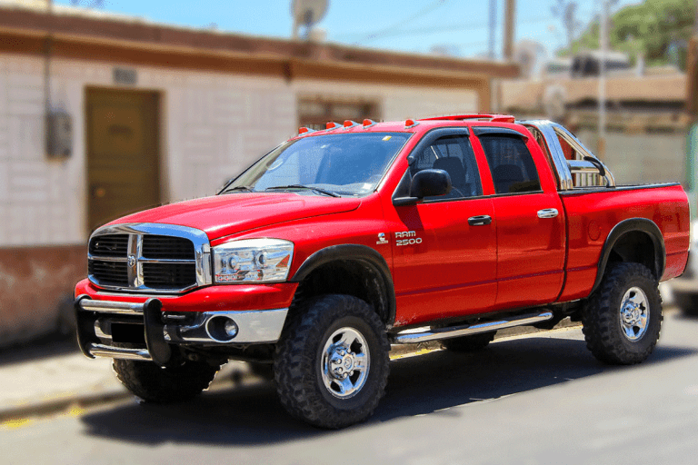Ram 2500 Red Type Truck Parked in front of an apartment, Truck Dies When I Give It Gas - Why And What To Do?