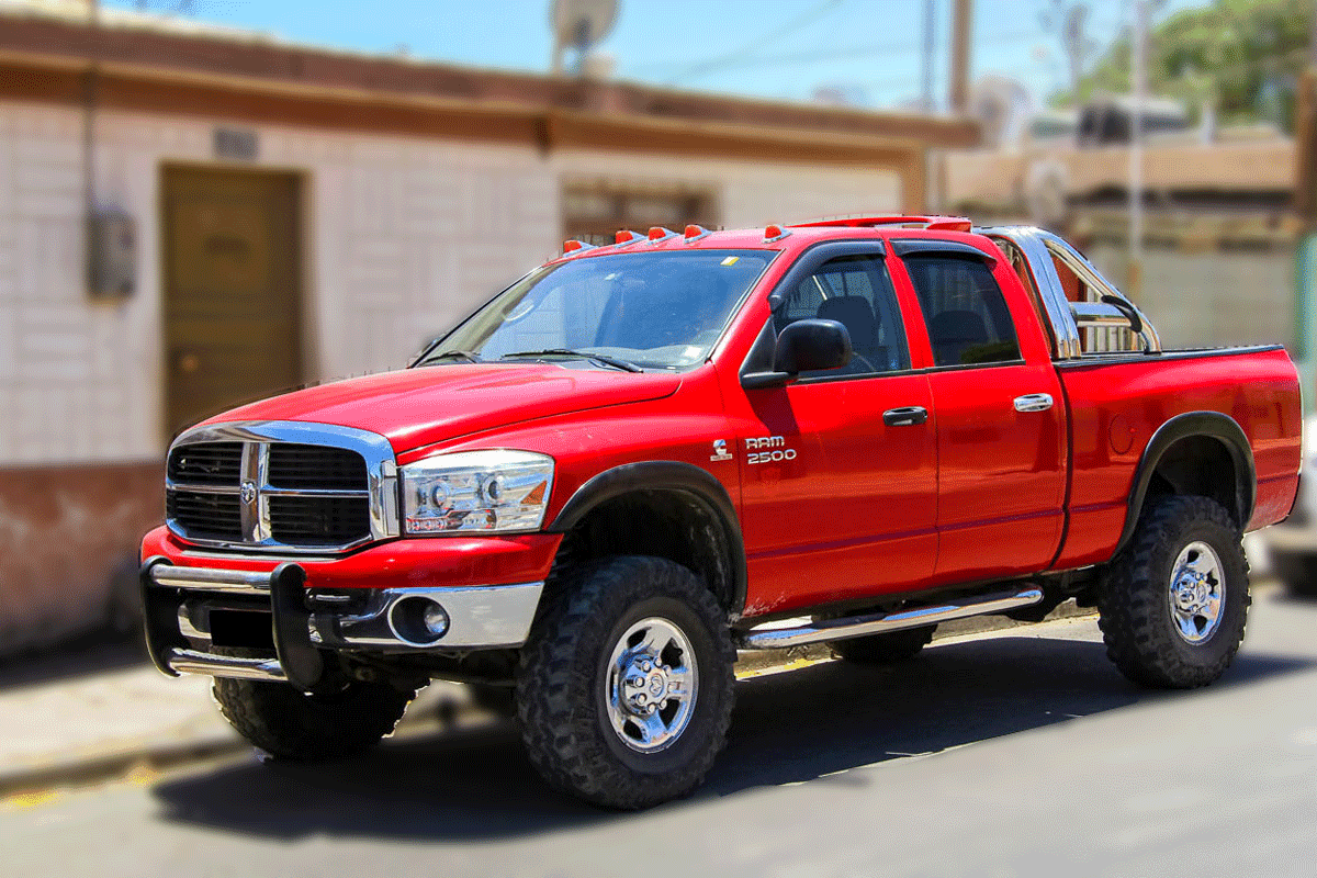 Ram 2500 Red Type Truck Parked in front of an apartment