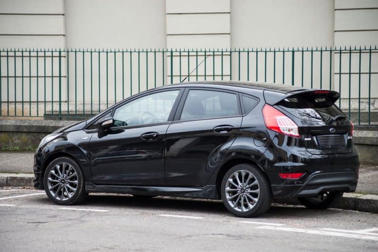 Rear view of black Ford fiesta parked in the street, Ford Fiesta Aux Input Is Not Working—Why And What To Do?