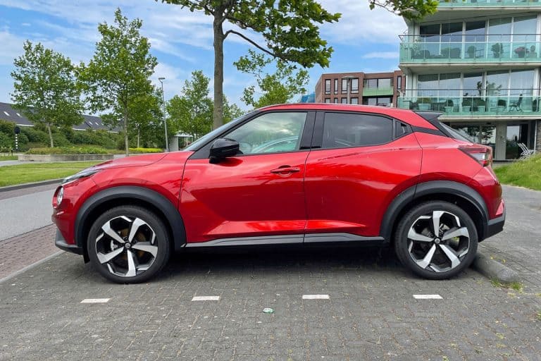 Red Second-generation Nissan Juke parked on a public parking lot, What Is The Best Oil For Nissan Juke?