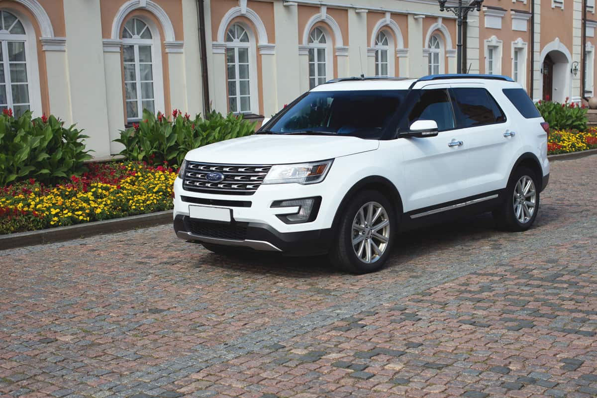 buying of expensive family house , parked SUV Ford explorer white color