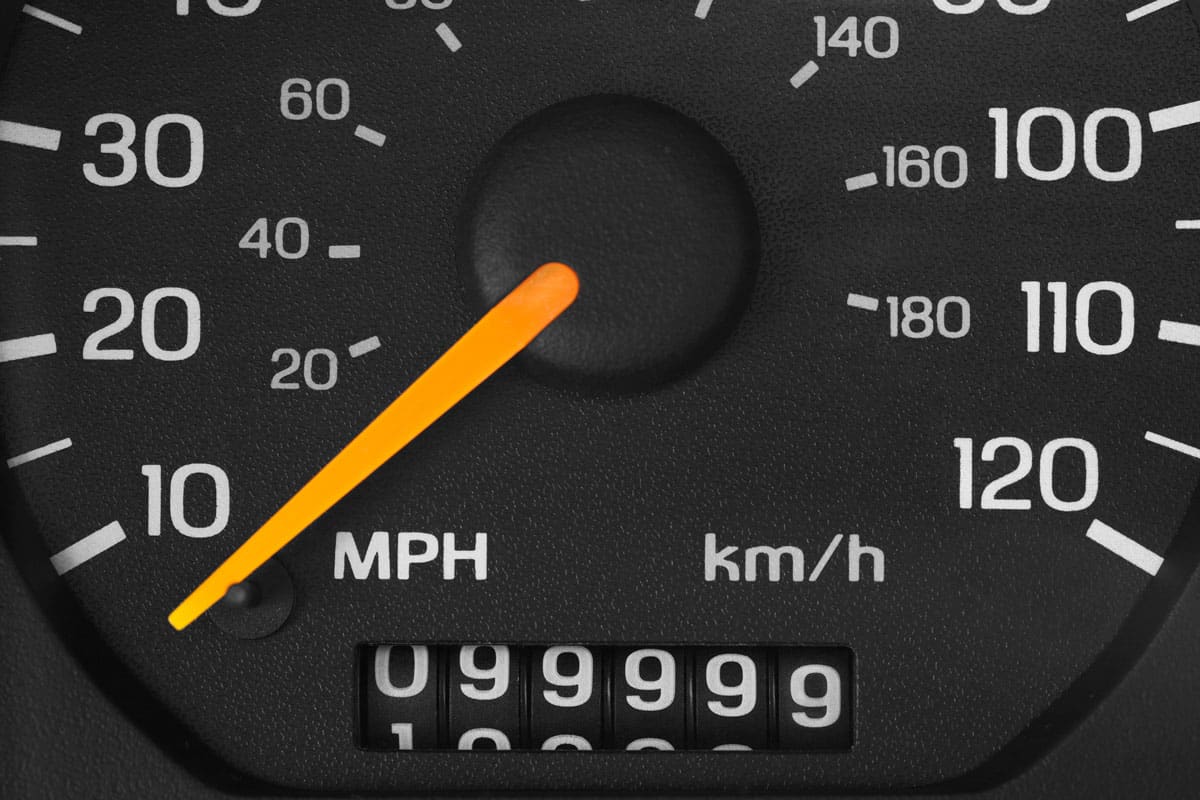 close up photo of a 99999 odometer of a car vehicle speedometer