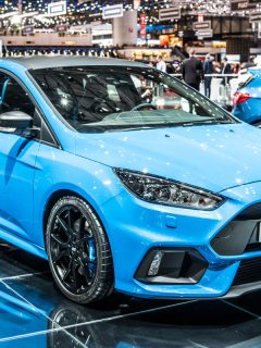 photo of a sky blue color paint on brand new ford focus on the display, Ford Focus Says Transmission Fault Service Now? Here's What To Do