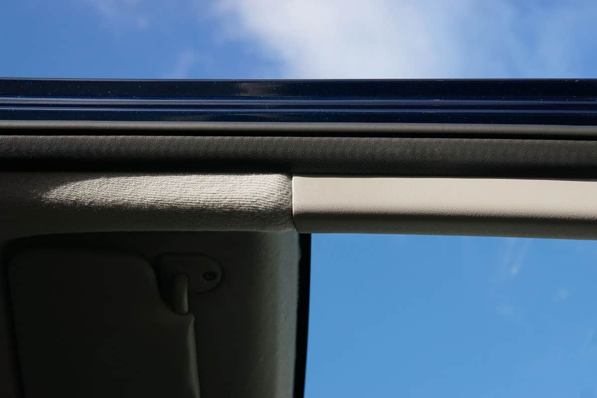 A Basic Car Door Metallic Frame, Showing Focus to the Rubber Cushion with Plastic Trim and Overhead Roof Fabric