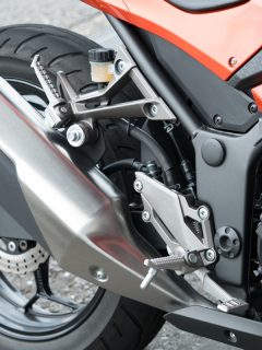 A motorcycle exhaust system photographed up close, How Hot Does A Motorcycle Exhaust Get?