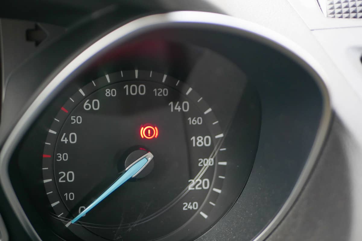 Brake light indicator glowing on the dashboard