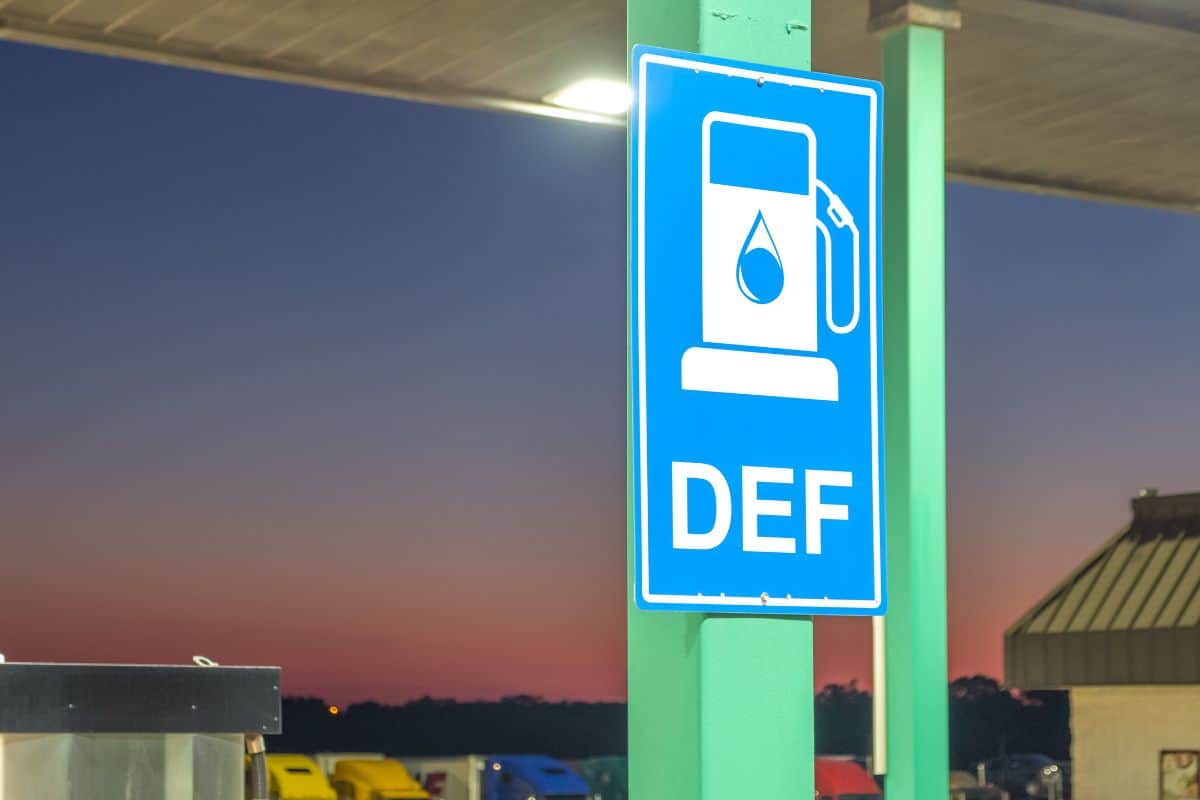Diesel exhaust fluid or DEF sign posted in a truck stop, next to fuel pump
