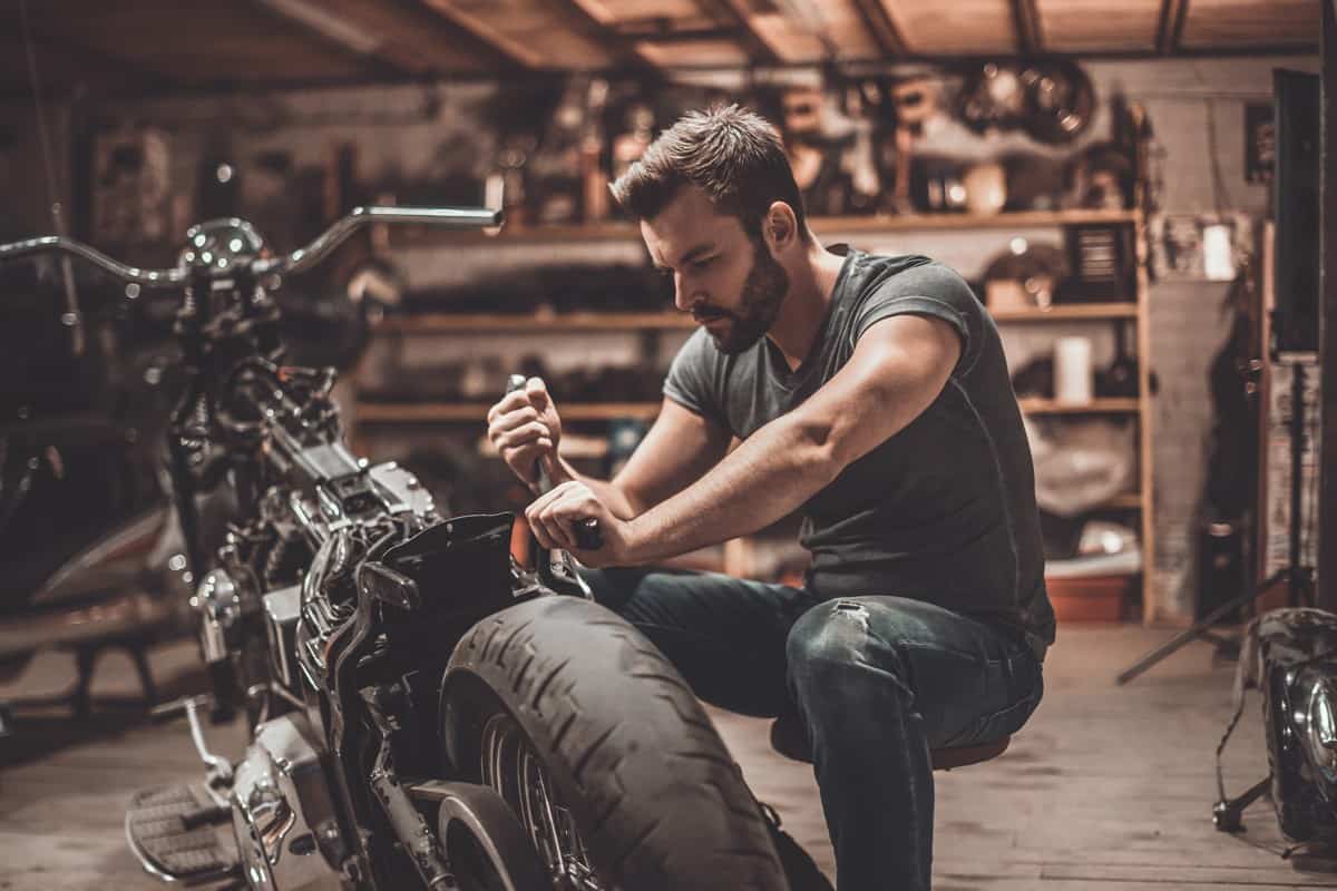 Mechanic checking his motorcycle