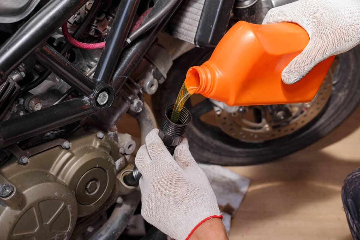 Pouring new and clean motorcycle oil