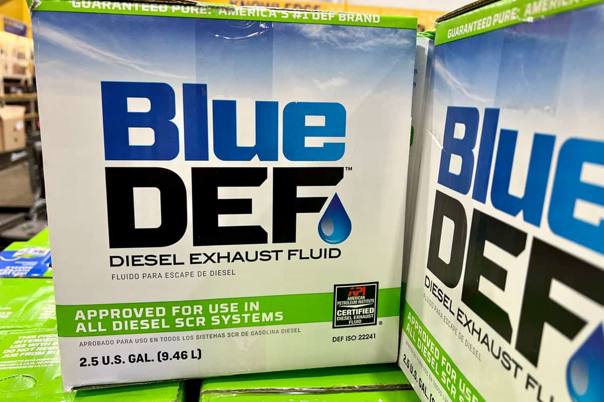 blue DEF diesel exhaust fluid in boxes inside an auto parts store