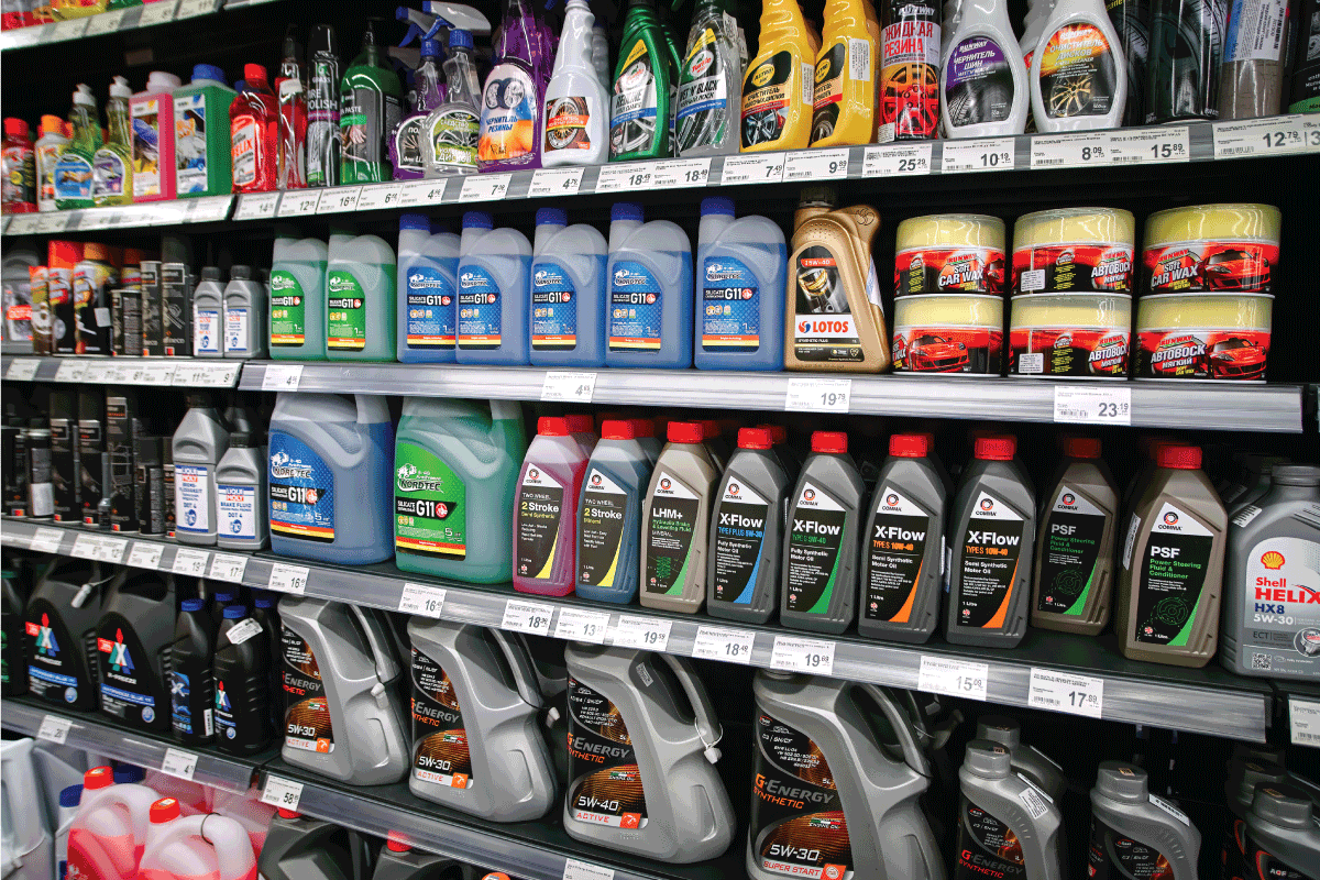 motor oils and other brands, car lubricants and additives in large supermarket.