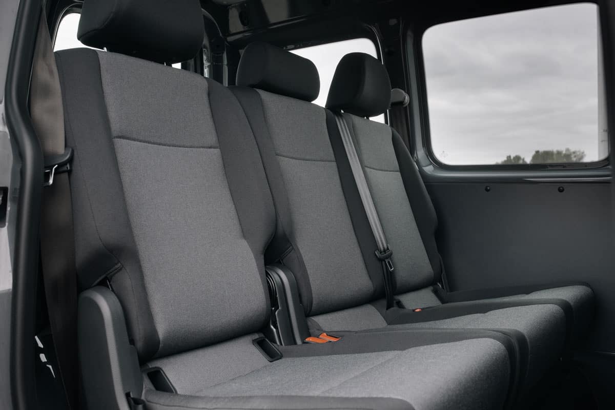 minivan rear seats row close up black grey fabrics on the seats