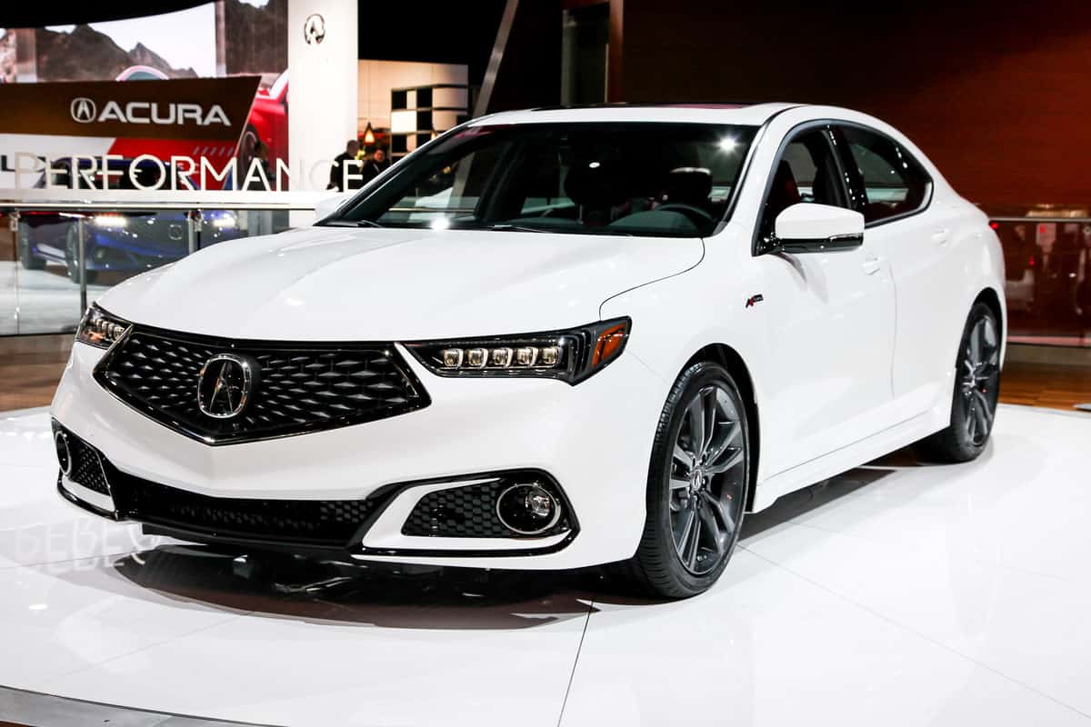 very neat glossy metallic white paint of a brand new tlx acura 2022 model