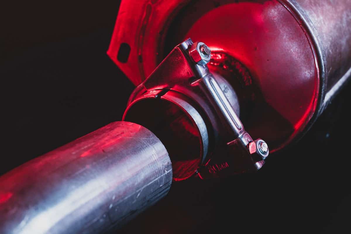photo of an Exhaust joint and silencer red light glowing close up