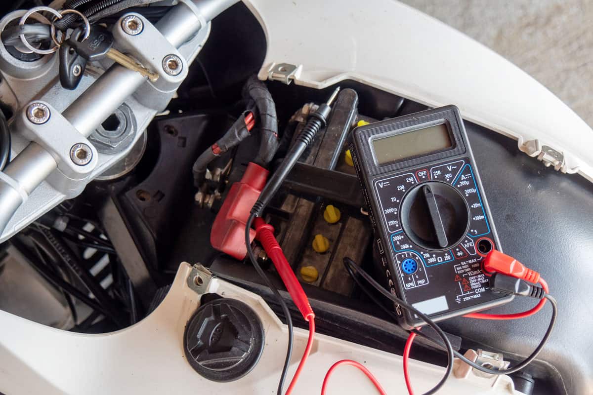 A check volt of battery with motorcycle service concept