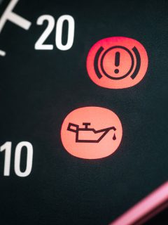 Car with oil and hand break icon. Warning, maintenance and service lights in dashboard, Can You Unplug Oil Pressure Sensor [Can I Drive With It Unplugged]?