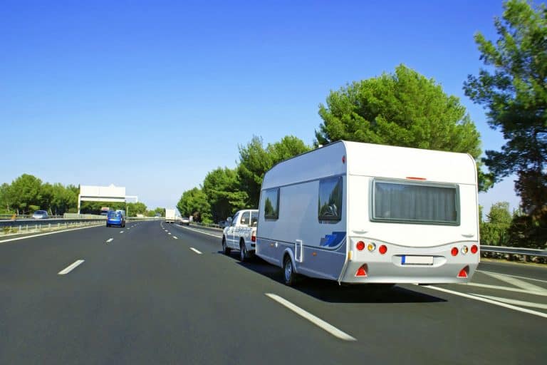 Caravan on the highway for holidays, Can I Tow A Twin Axle Trailer With A Car?