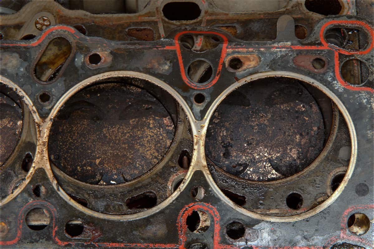 Engine detail after haead gasket failure, full of carbon and oil deposits