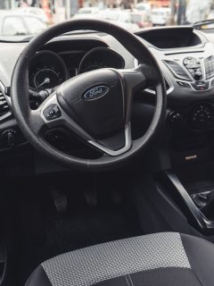 Interior of a Ford Escape showing the steering wheel and dashboard, Ford Satellite Radio Antenna Fault - What To Do?