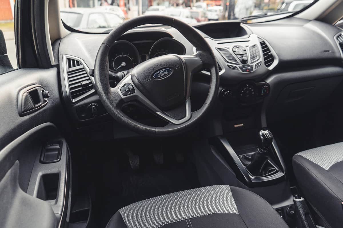 Interior of a Ford Escape showing the steering wheel and dashboard