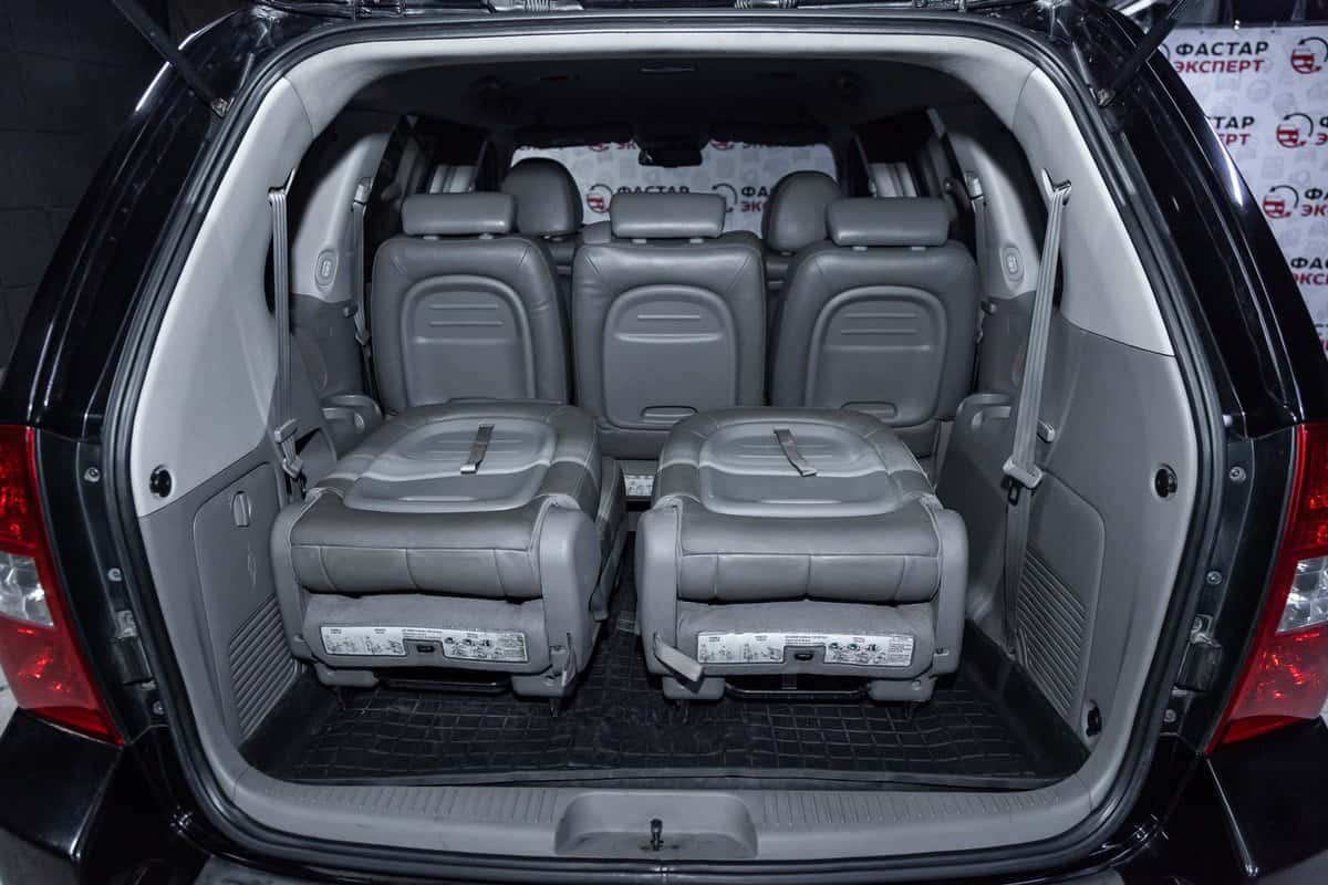 Kia Carnival, close-up of the rear seats. Photography of a modern car on a parking in Novosibirsk